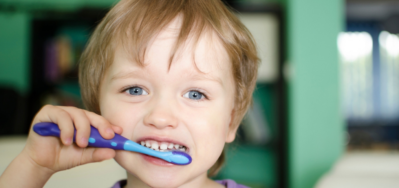 Little boy brushing teeth